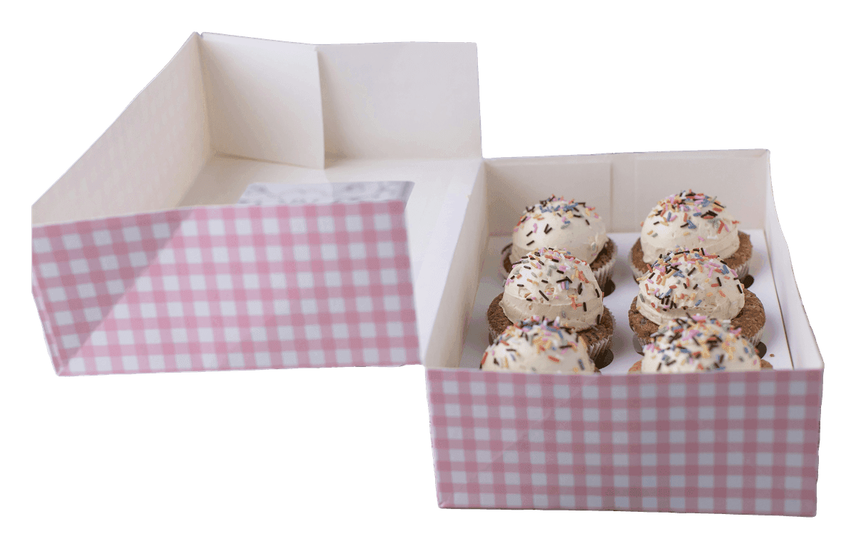 Six sprinkle-topped cupcakes in an open pink gingham box