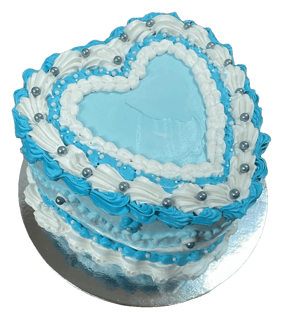 Blue and white vintage-style heart cake with piped shell borders and silver pearls, made in Townsville