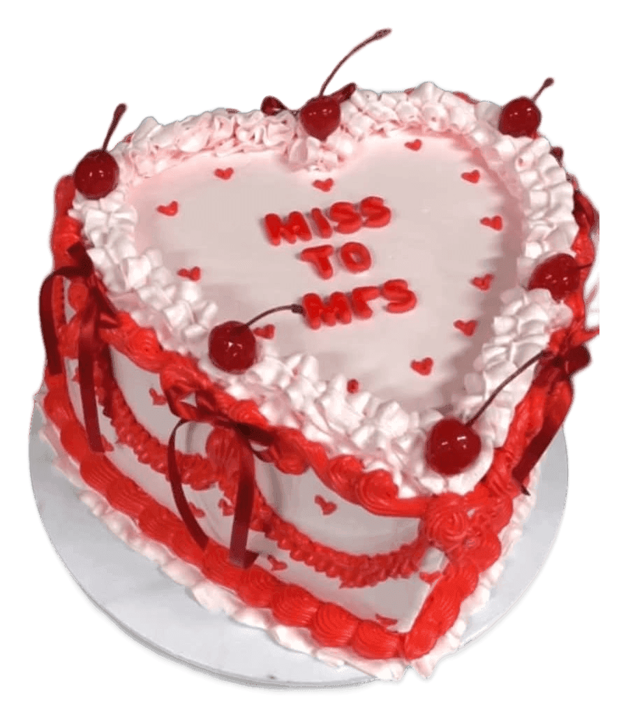 Pink vintage piped heart cake with red frills and cherries, made in Townsville
