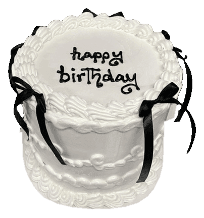 White vintage-style cake with black satin bows and happy birthday piped on top, made in Townsville