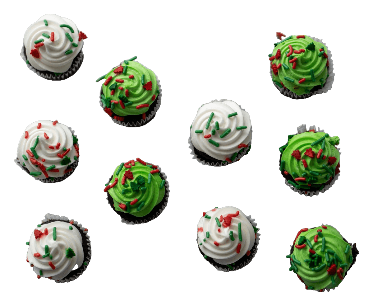 Cupcakes with white and green buttercream and red and green Christmas sprinkles