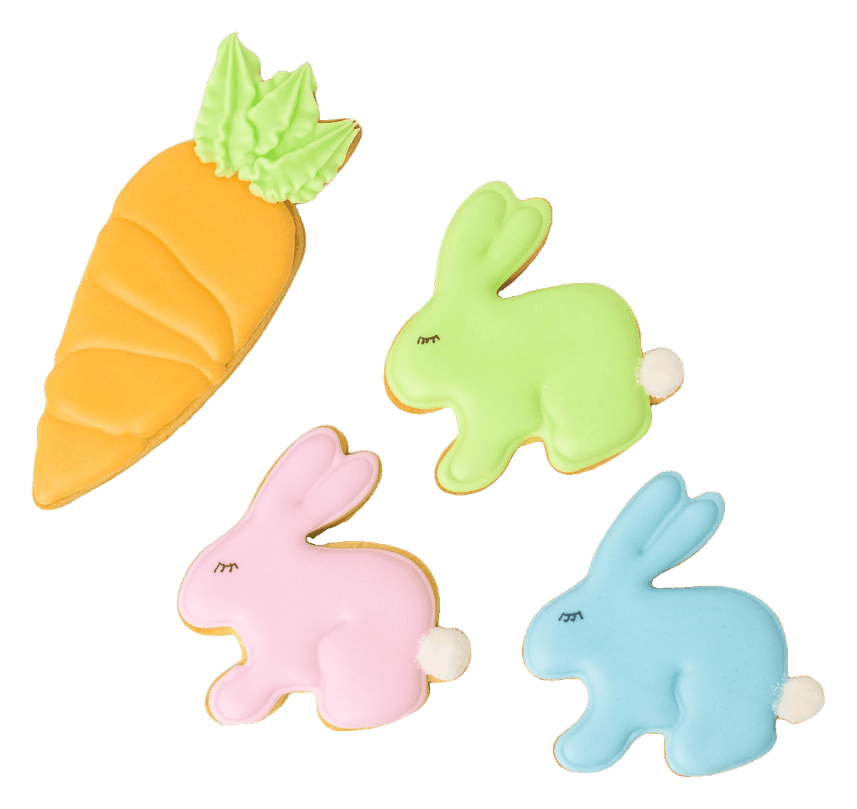Pastel iced sugar cookies shaped like bunnies and a carrot