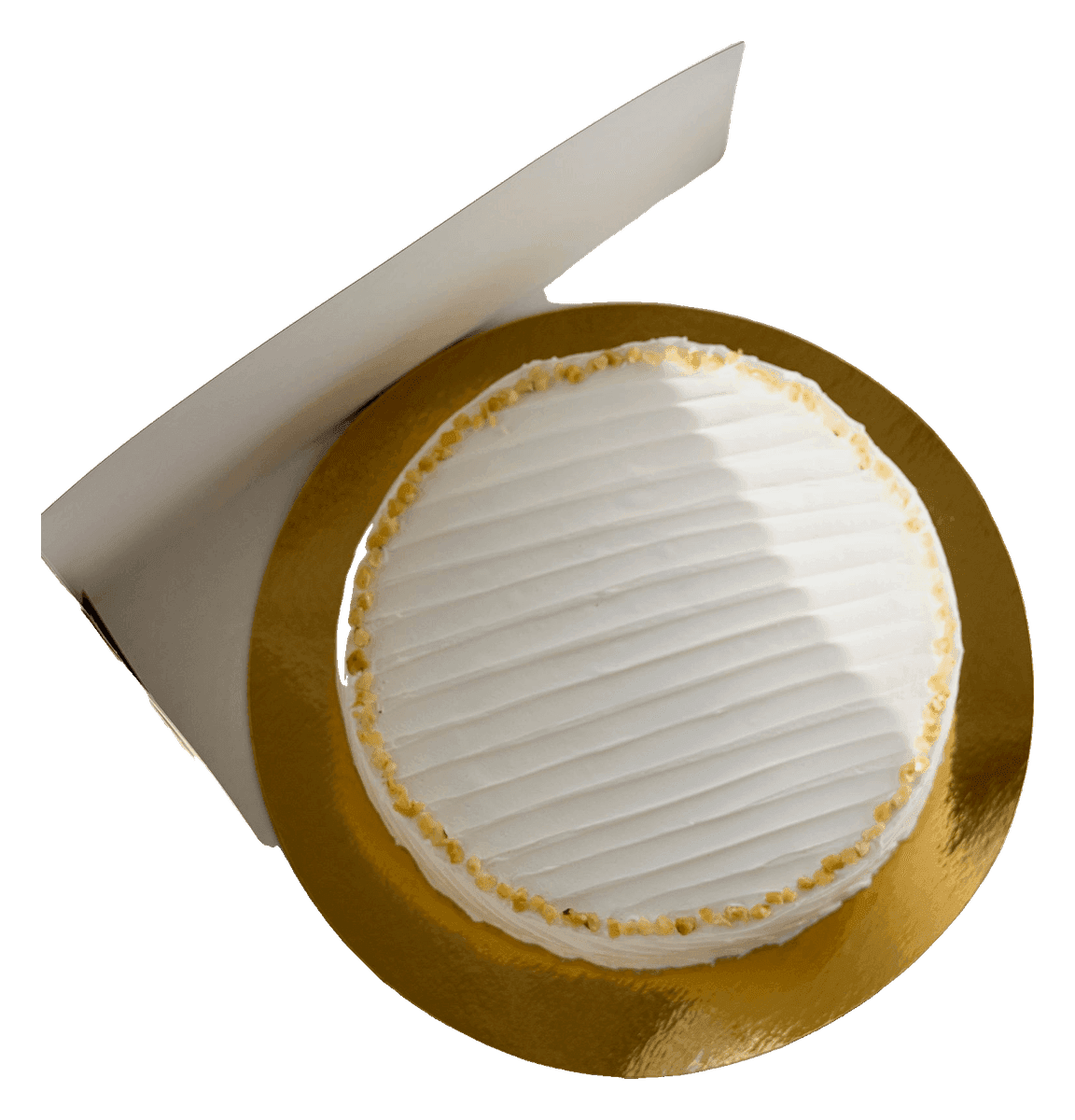 White buttercream cake on a gold board in an open cake box